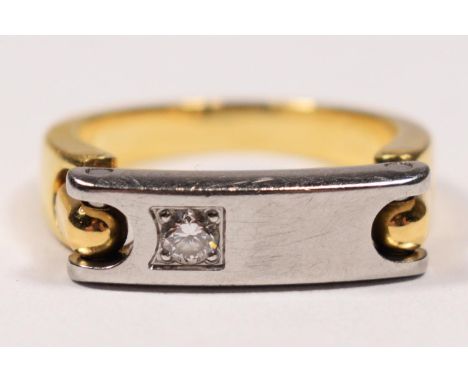 A Pequignet, 18k gold and stainless steel brilliant cut diamond ring, bearing control marks, with signed articulated panel, I