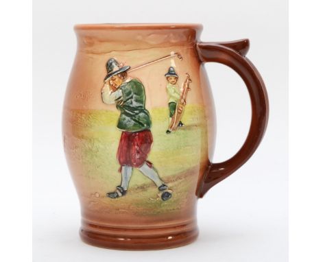 A Royal Doulton jug, depicting a golfer mid swing with a caddy, signed on base with makers mark and D5719, 15cm tall 