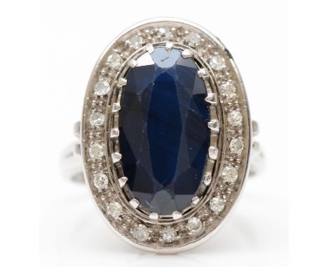 A vintage 14ct white gold sapphire and diamond cluster ring, Edinburgh 1983, 20 x 14mm, L, 7.6gm 