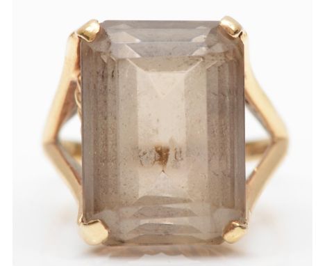 A vintage 9ct gold and smokey quartz ring, London 1968, claw set with an emerald cut stone, 18 x 13mm, Q, 7.2gmGood condition