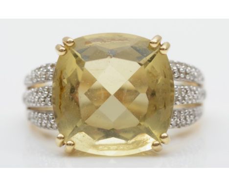 A 9ct gold citrine and diamond dress ring, claw set with a mixed cut stone, 14 x 14mm, diamond set shoulders, O, 6.3gm 