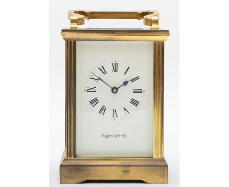 A mid 20th century brass carriage clock, retailed by Mappin &amp; Webb, having enamelled dial with Roman numerals and an eigh