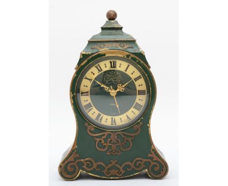 A Jaeger Petite Neuchateloise musical alarm clock, the brass case with applied floral decoration on a green ground. 16cm tall