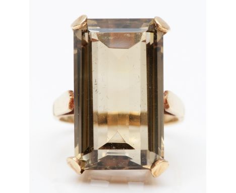 A vintage 9ct gold and smokey quartz dress ring, stamped 9ct, claw set with an emerald cut stone measuring 22 x 13mm, O 1/2, 