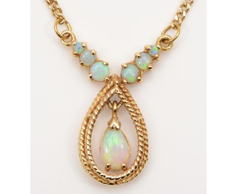 A 14K gold and opal pendant, with articulated pear shape drop, 41cm, 6.5gm 