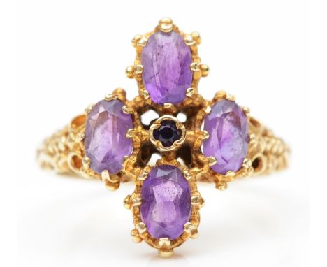 A vintage 9ct gold and amethyst dress ring, London 1977, with carved shoulders, O 1/2, 4.2gm 