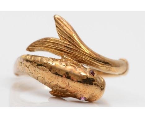 An 18ct gold coiled fish ring, London 1977, lacking carat mark, with textured body and ruby eyes, P 1/2, 4.1gm 
