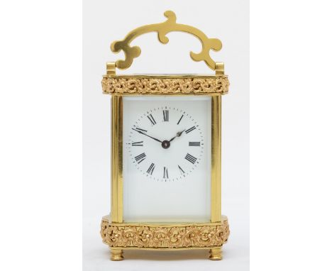 A mid 20th century brass carriage clock, having enamelled dial with Roman numerals, with platform escapement and eight day mo