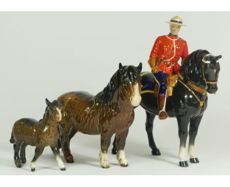 A Beswick model of a Canadian Mountie policeman on a horse, H21cm, together with two Beswick Shetland ponies. (3) Canadian Mo