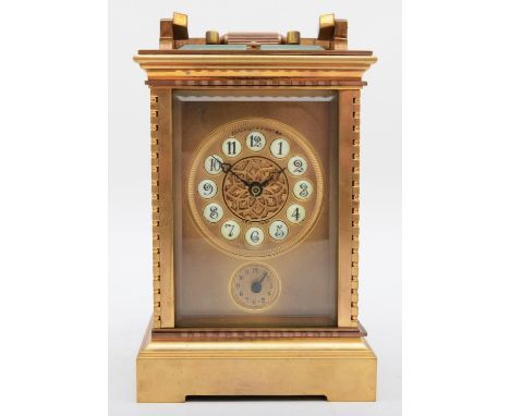 A 20th century polished gilt brass striking and repeating carriage clock, having push button repeat and alarm, the matt gilt 