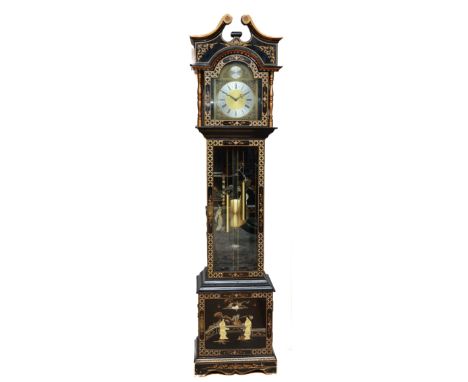 A Chinoiserie lacquered longcase clock, the ebonised case with gilt border, painted Oriental landscape scenes and raised figu