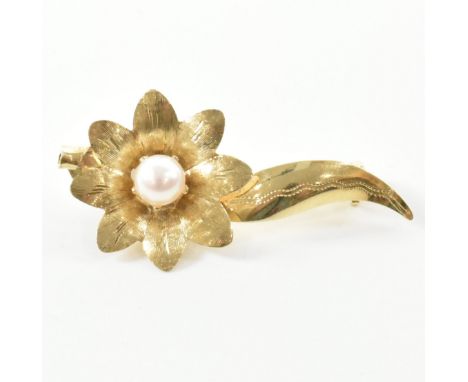 A vintage gold and pearl floral spray brooch pin. The brooch in the form of a floral spray set with a single pearl having etc