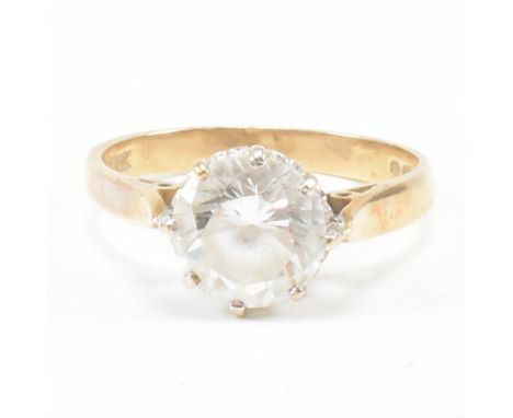 A vintage hallmarked 9ct yellow gold and CZ solitaire ring. The single stone engagement style ring having a round cut CZ to p