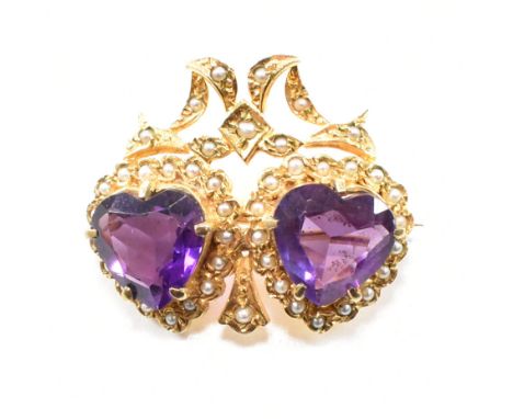 A hallmarked 9ct yellow gold, amethyst and&nbsp; pearl brooch pin. The antique style twin heart brooch having two heart cut c