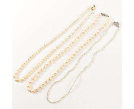 Three pearl necklaces. The necklaces to include a cultured pearl necklace strung with 6-7mm off round pearls to silver clasp.