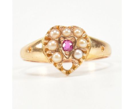 An early 20th century&nbsp; hallmarked 15ct gold pearl and ruby ring. The ring having a heart shaped head set with central ol