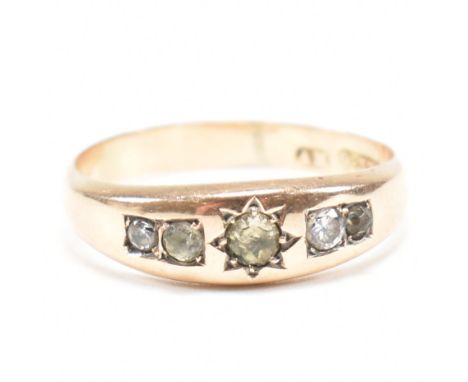 A 19th century Victorian hallmarked 9ct gold white stone and yellow stone gypsy ring. The ring set with a central round cut y