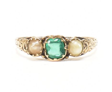 A 19th century gold, green paste and pearl three stone ring. The ring having a central emerald cut green paste stone flanked 