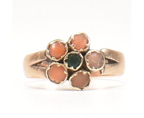 A 19th century 9ct gold, coral and green stone flower ring. The flower ring having a central bezel set round cut green stone 