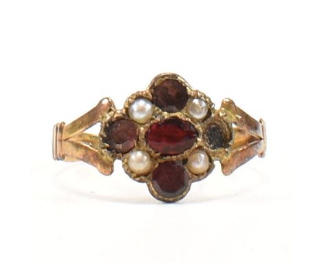 A 19th century Georgian gold garnet and pearl cluster ring. The ring having flat cut garnets with bead decoration to bifurcat