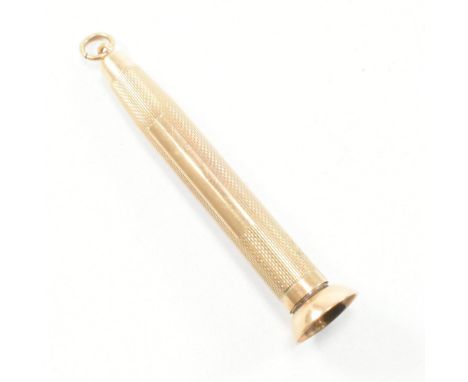 A hallmarked 9ct gold cigar piercer. The piercer having engine turned decoration to body and a vacant cartouche having bale t