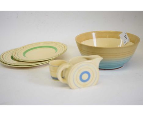 A Clarice Cliff Bonjour shaped milk jug together with bowl, egg cup and 3 side plates all with a circular design (6)bowl 18cm