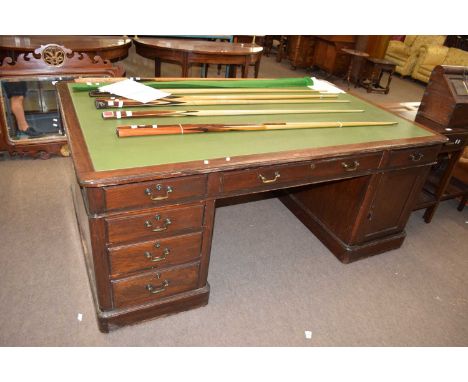 20th century hardwood partners desk, the rectangular top with leatherette inset writing surface over two sides, each with six