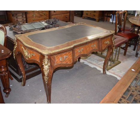 Reproduction Continental bureau plat fitted with three drawers and an inset writing surface, extensive decorative metal mount