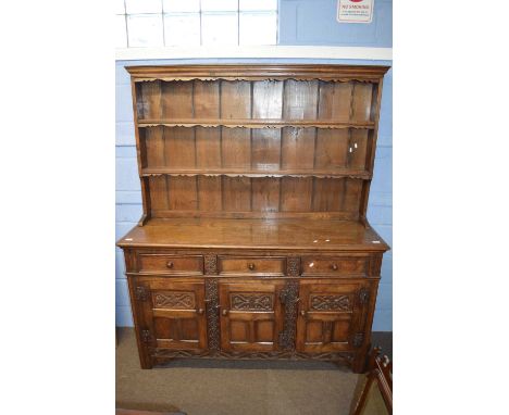 Good quality reproduction oak dresser with moulded cornice and two shelves to back over a base with three drawers and three d