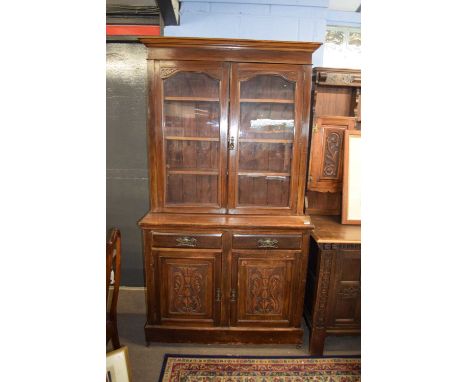 Late Victorian mahogany bookcase cabinet, the top section with two glazed doors opening to shelved interior over a base with 