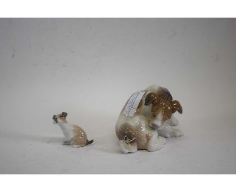 A Lladro model of a terrier with butterfly seated on its tail together with a smaller example (2)Butterfly re-stuck