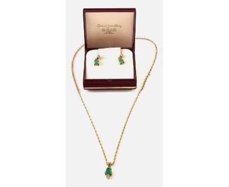 A 9ct gold pear shaped emerald and diamond pendant, on a twisted rope chain marked '9c', together with an unmarked pair of ma