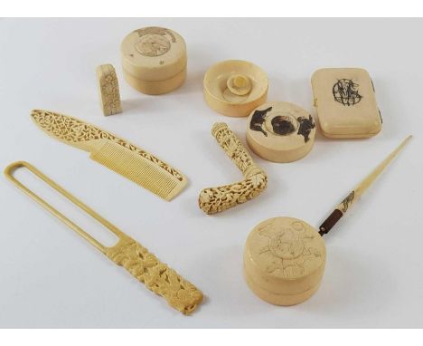 A collection of ivory items to include a comb with cut out decoration handle, a seal, boxes with covers and other items