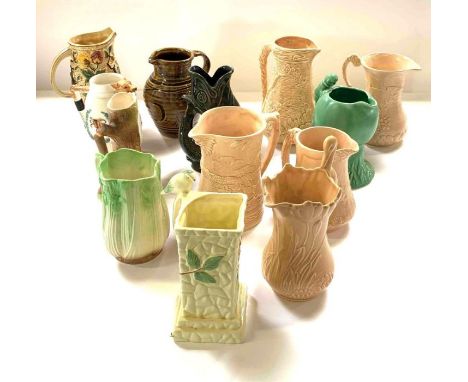A dark green Dartmouth Pottery fish guggle jug, together with a collection of ceramic jugs, largely made by Sylvac
