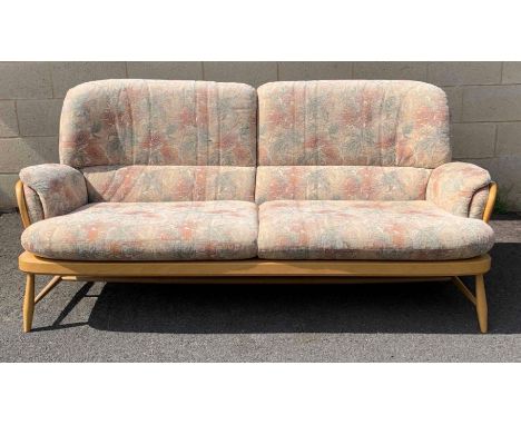 An Ercol beech and and elm two seater sofa 