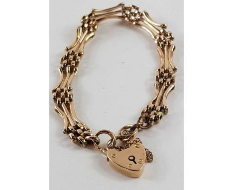 A gate bracelet with heart padlock and safety chain, marked '9ct', 9.17g gross