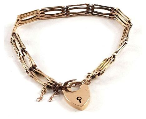 A fancy link gate bracelet with heart padlock and safety chain, marked '9ct', 13.06g gross