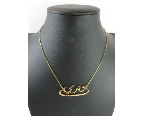 A necklet with central name section in Arabic, on a fine box link chain, marked '750', 6.36g gross