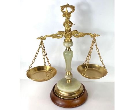 A 20th century set of brass and onyx weighing scales, standing on circular wooden base, 47cm high, 38cm long