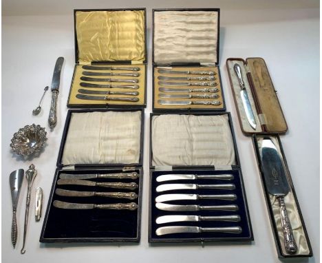 Three cased sets of butter knives with silver handles, a cased set of four butter knives with silver handles, a silver souven