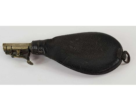 A Victorian shot flask, the leather pear shaped bag, having a white metal collar and brass nozzle measuring 1 and 1 1/4 oz st