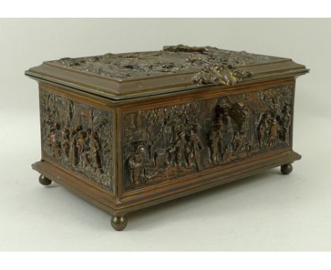 A bronzed trinket box, richly decorated with hunting and revelry scenes, in deep detailed relief, with blue silk buttoned lin