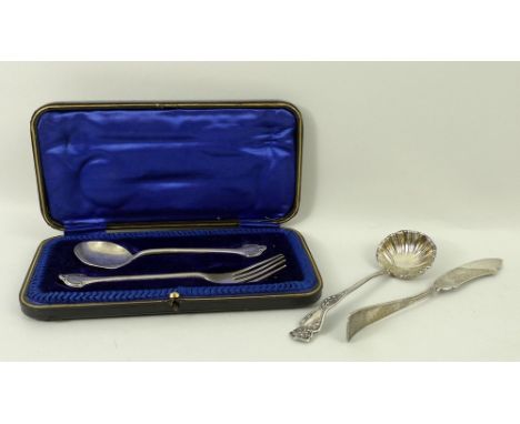 A silver spoon and fork with embossed scroll decoration, Joseph Rodgers & Sons, Sheffield, 1915, cased, an American silver su