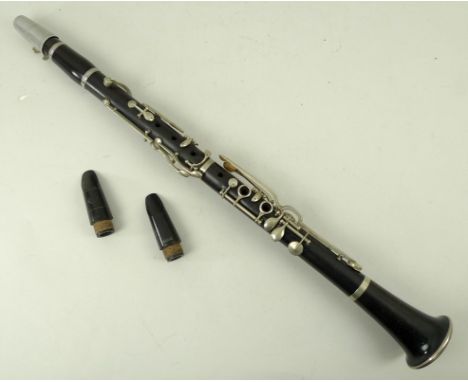 A clarinet, with Henri Selmer mouth piece, and two further mouthpieces, in a leather carrying pouch. 
