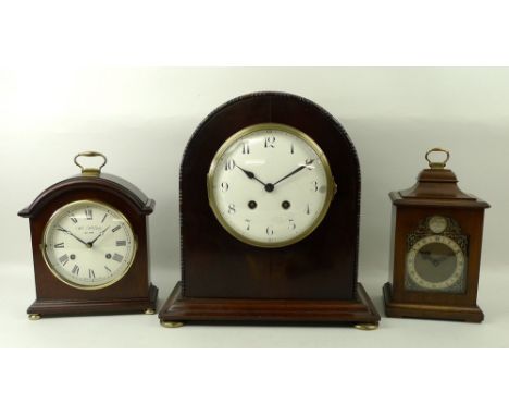 A group of three mantle clocks, comprising a Rotherham presentation clock, movement stamped 15875, with cream chapter dial an