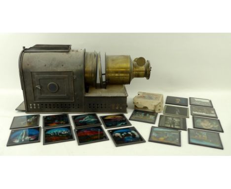 A brass slide projector and a collection of Victorian and later 3.25 inch glass slides, depicting topographical scenes, photo