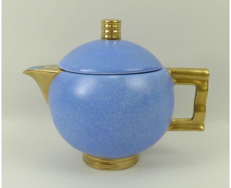 A Carlton Ware bachelor tea set, Moderne pattern in blue ground with gold handles, comprising tea pot, milk jug, sugar bowl (