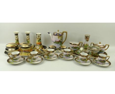 A Noritake porcelain nine piece dressing table set, bearing marks for 1908, painted with a rural scene, comprising tray, a pa