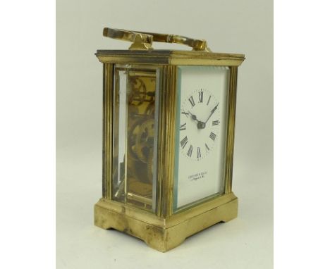 A Garrard & Co Ltd brass cased carriage clock, enamel dial bearing Roman numerals, single barrel movement, with key, 8 by 6 b
