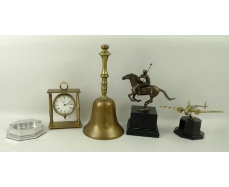 An aluminium ashtray, possibly from Concorde, 11.5cm diameter, a brass school bell, 27cm high, a Kim B bronze art model of a 